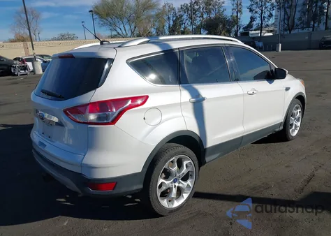 2014 Ford Escape Titanium z USA, uszkodzony, nr VIN 1FMCU9J92EUB16573